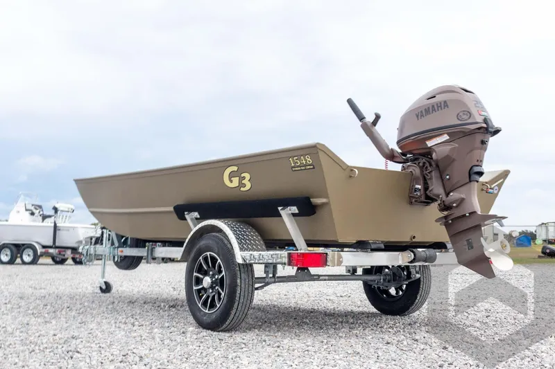 Slide: The Image of 2026 G3 Gator Tough 1548 VBW boat with Yamaha motor on trailer, outdoor setting. - 13