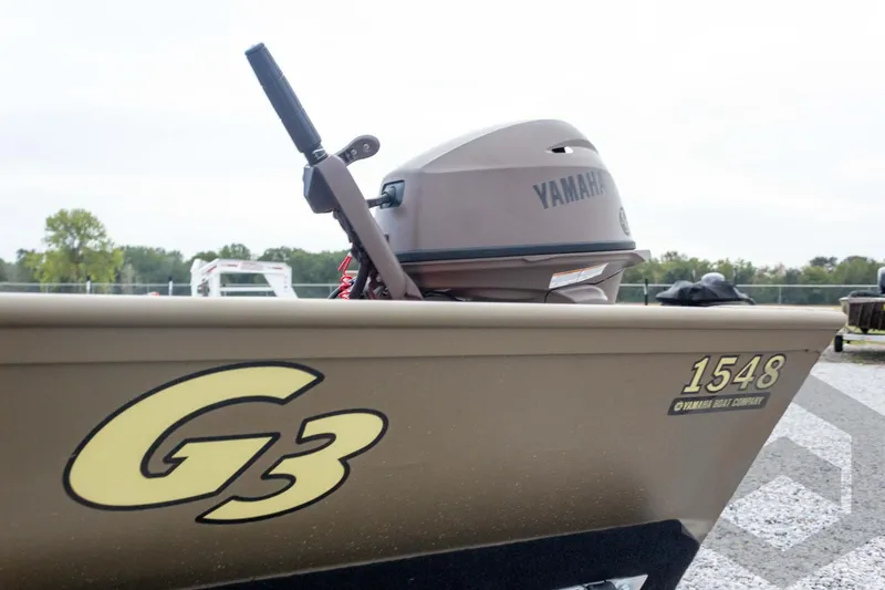 Slide: The Image of 2026 G3 Gator Tough 1548 VBW boat with Yamaha motor, parked outdoors. - 15