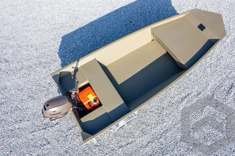 Slide: The Image of 2026 G3 Gator Tough 1548 VBW boat with Yamaha motor on gravel surface. - 31