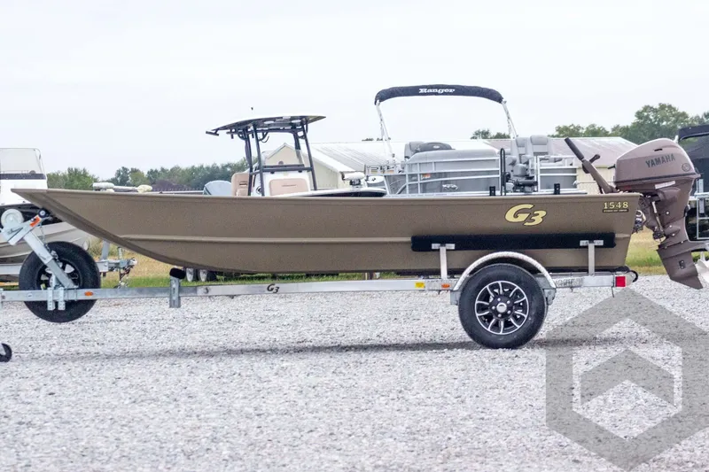 Slide: The Image of 2026 G3 Gator Tough 1548 VBW boat on trailer, side view, outdoors. - 6