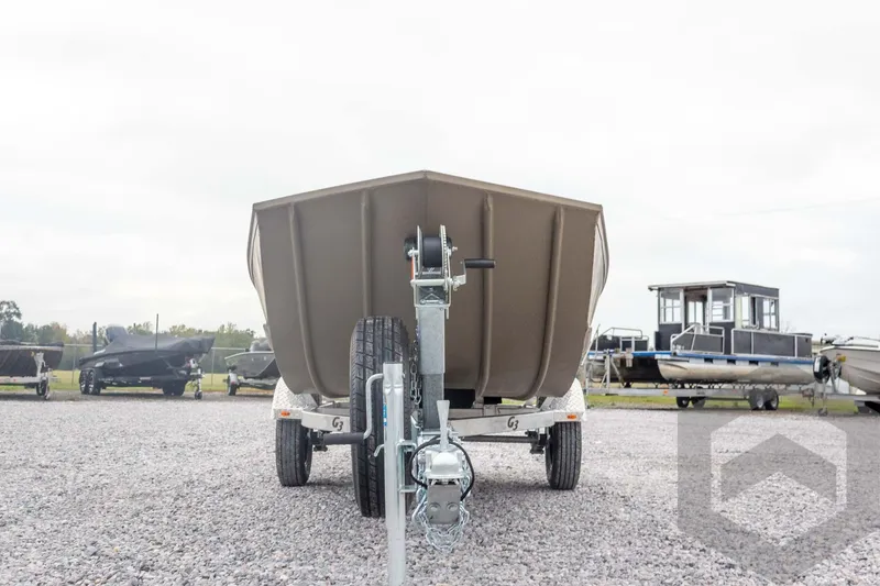 Slide: The Image of 2026 G3 Gator Tough 1548 VBW boat on trailer, front view, in a gravel lot. - 8