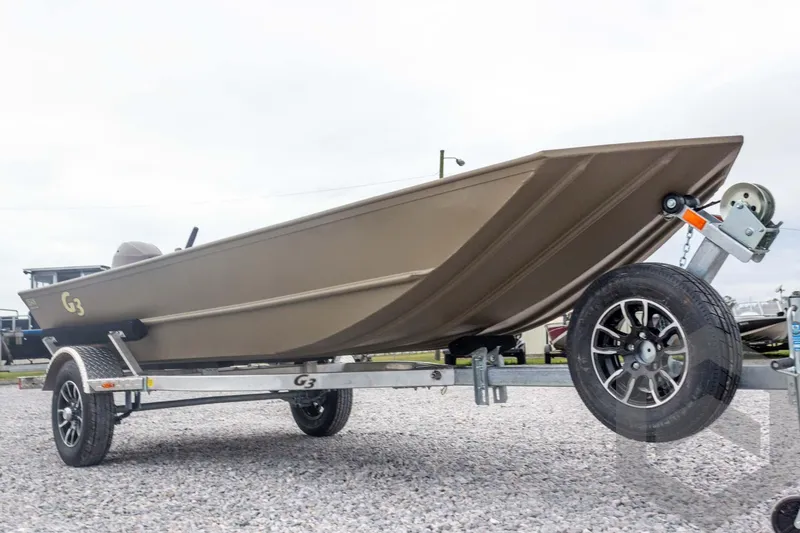 Slide: The Image of 2026 G3 Gator Tough 1548 VBW boat on trailer, displayed outdoors. - 9