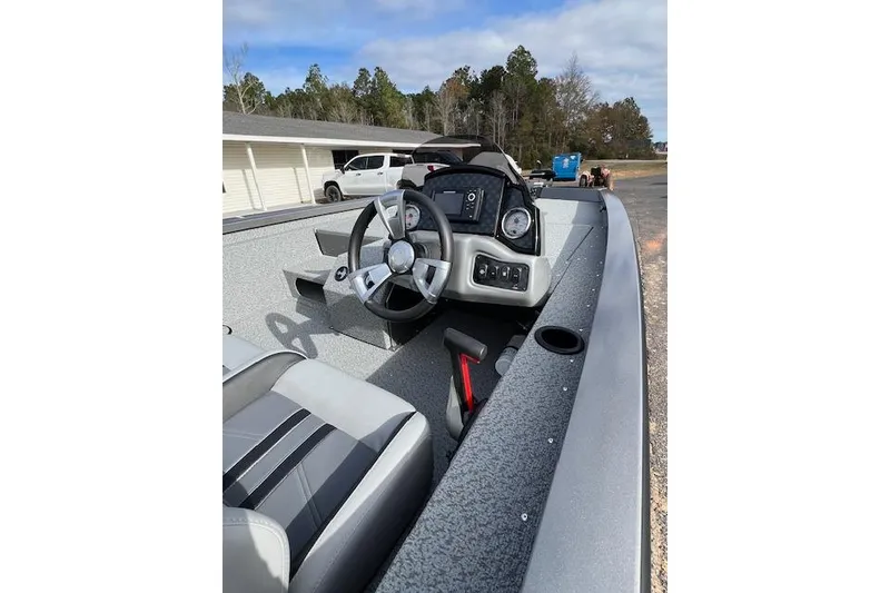 Slide: The Image of 2026 G3 Sportsman 1710 SE boat interior with steering wheel and dashboard controls. - 4