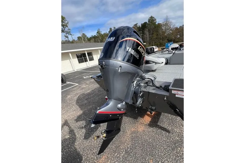 Slide: The Image of 2026 G3 Sportsman 1710 SE boat with Yamaha outboard motor in parking lot. - 7