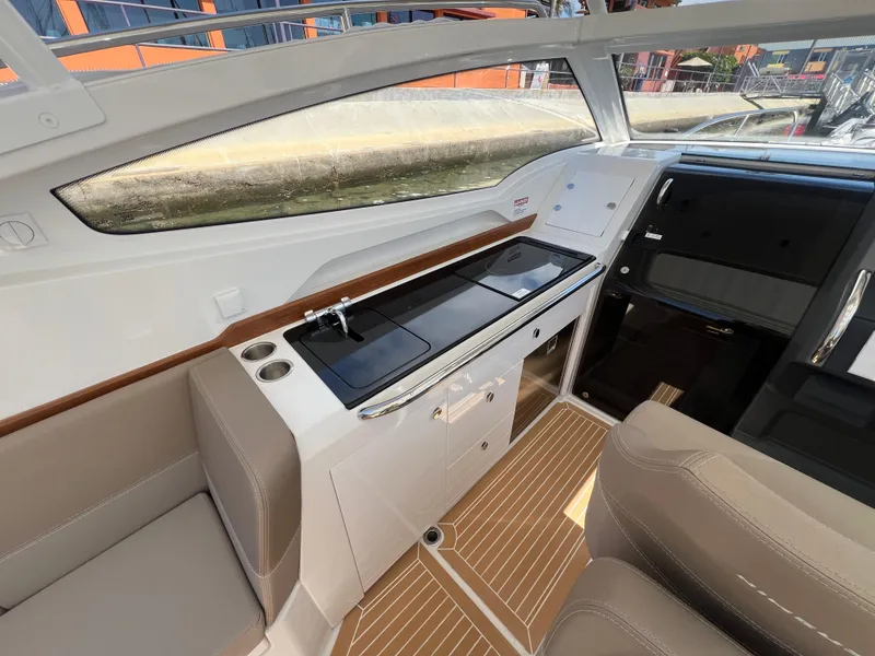 Slide: The Image of Luxurious interior of 2024 Nimbus W9 boat with sleek design and modern amenities. - 10