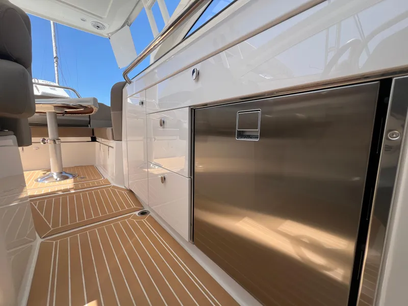 Slide: The Image of 2024 Nimbus W9 boat interior with sleek cabinetry and modern design. - 11