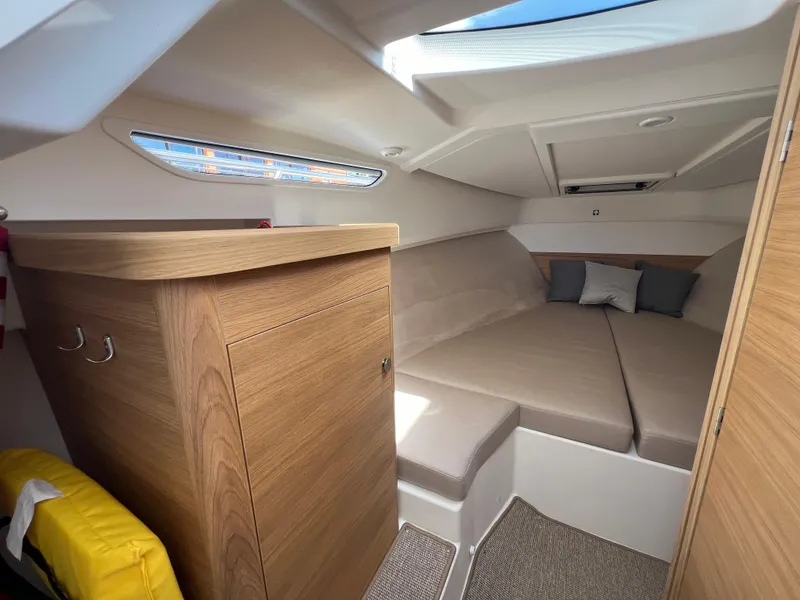 Slide: The Image of Cozy interior cabin of 2024 Nimbus W9 boat with modern wood finish and comfortable seating. - 13