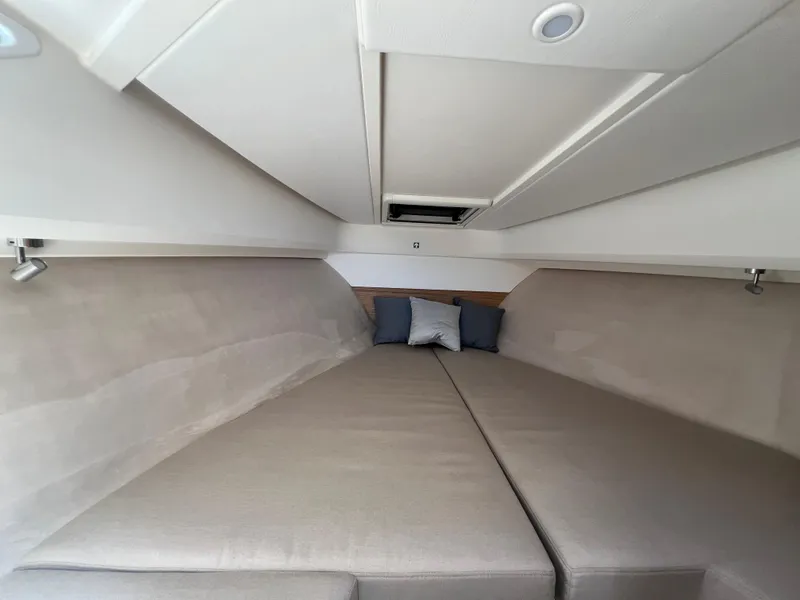 Slide: The Image of Luxurious interior cabin of 2024 Nimbus W9 boat with comfortable bedding. - 14