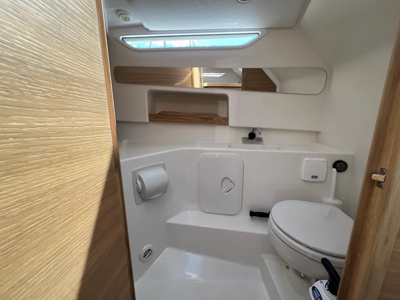 Slide: The Image of Modern bathroom in 2024 Nimbus W9 boat with sleek design and compact amenities. - 16
