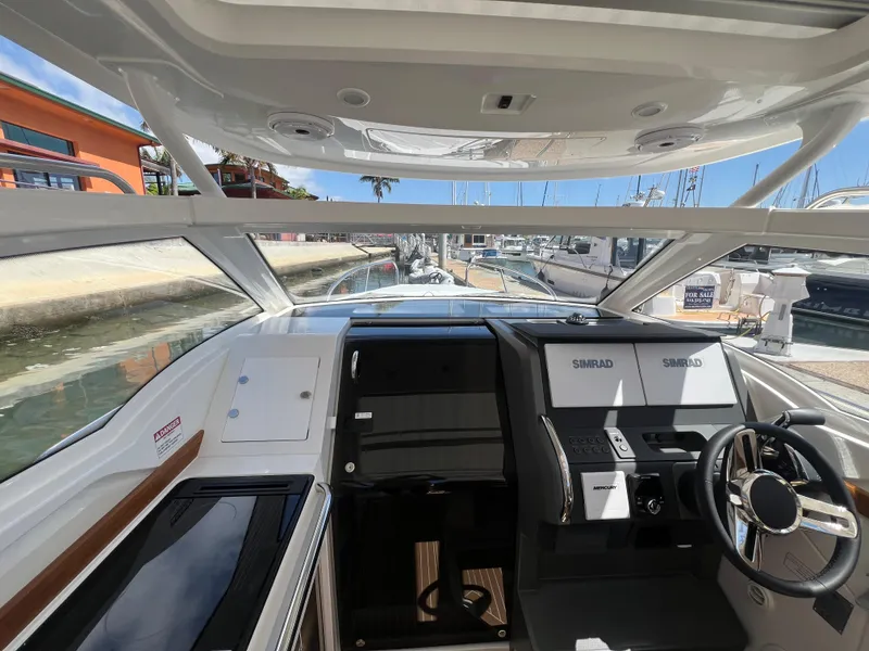 Slide: The Image of 2024 Nimbus W9 boat cockpit with modern controls and panoramic windows. - 7