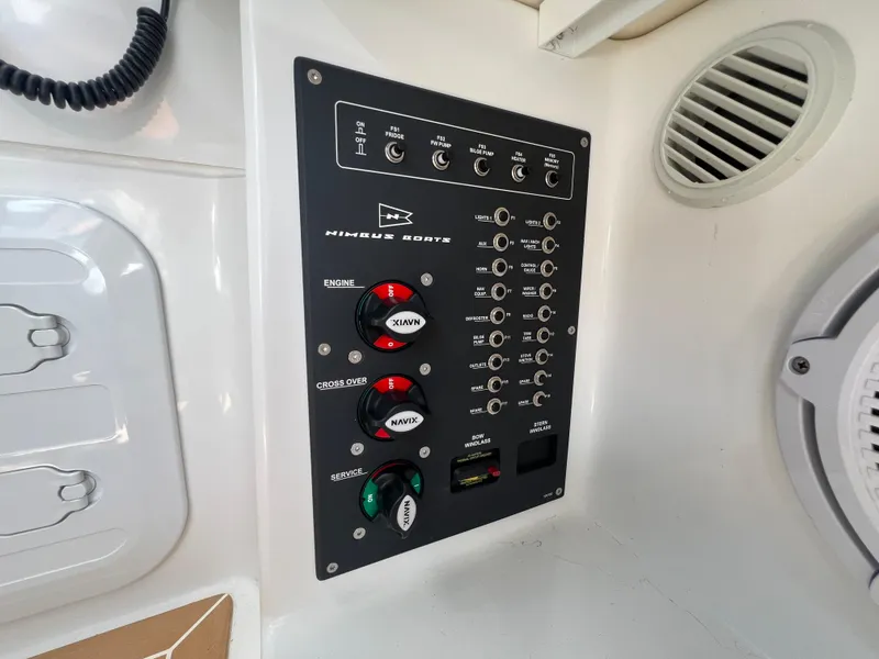 Slide: The Image of Control panel of 2024 Nimbus W9 boat with switches and dials. - 9