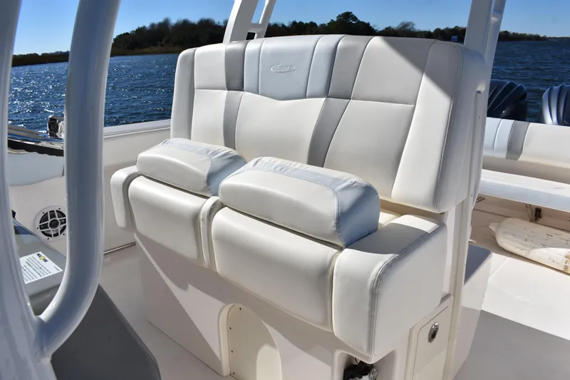 Slide: The Image of 2022 Robalo R272 Center Console boat with comfortable seating on a sunny day. - 20