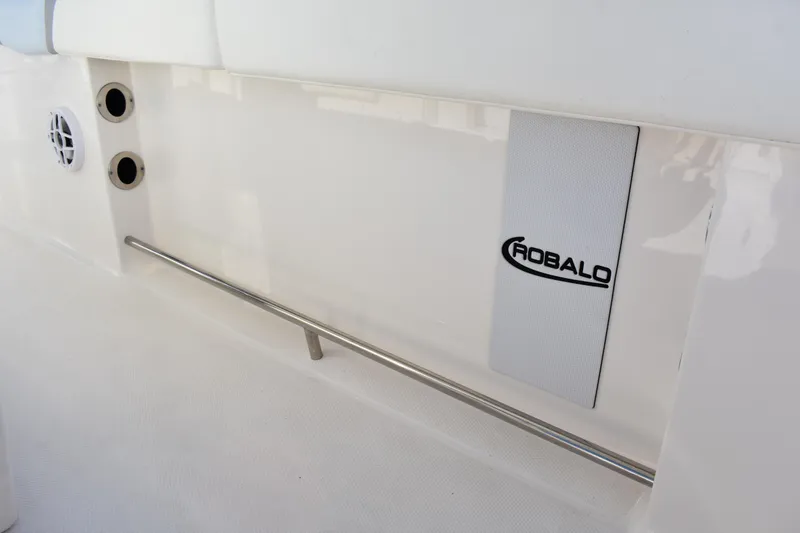 Slide: The Image of 2022 Robalo R272 Center Console interior detail with logo and stainless steel rail. - 35