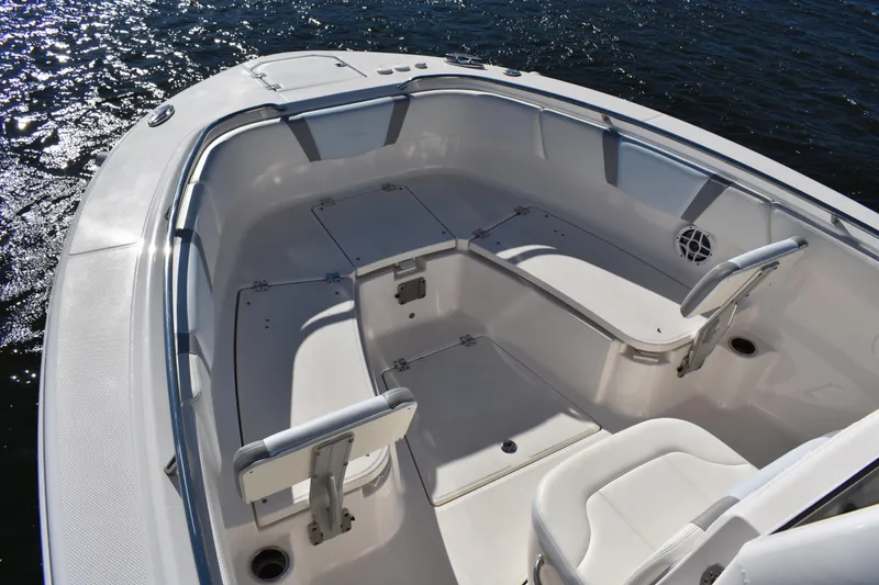 Slide: The Image of 2022 Robalo R272 Center Console boat interior with seating and storage compartments. - 8