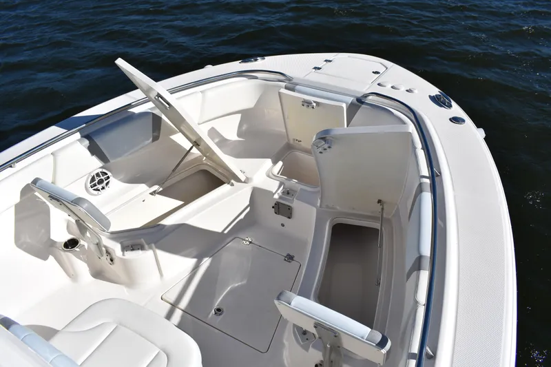 Slide: The Image of 2022 Robalo R272 Center Console boat interior with open storage compartments. - 9
