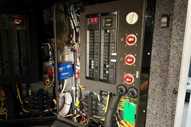 Slide: The Image of Electrical panel inside Life Proof 33, 2017 model, showcasing wiring and circuit breakers. - 10