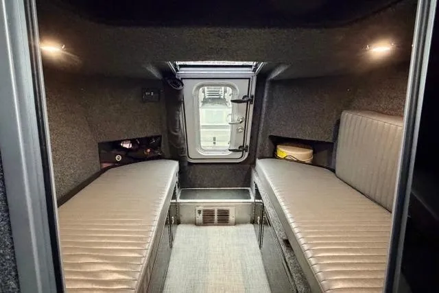 Slide: The Image of Interior of 2017 Life Proof 33 boat cabin with twin beds and overhead lighting. - 13