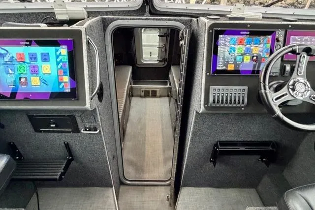 Slide: The Image of Control cabin of 2017 Life Proof 33 boat with dual screens and steering wheel. - 14