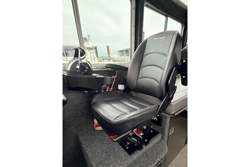Slide: The Image of Captain's seat in 2017 Life Proof 33 boat interior, featuring Shockwave suspension. - 18