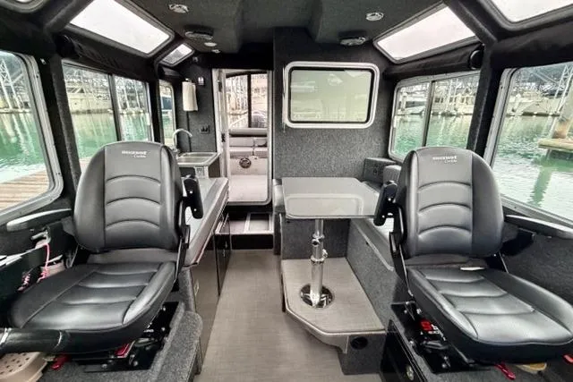 Slide: The Image of Interior of a 2017 Life Proof 33 boat with leather seating and table. - 19
