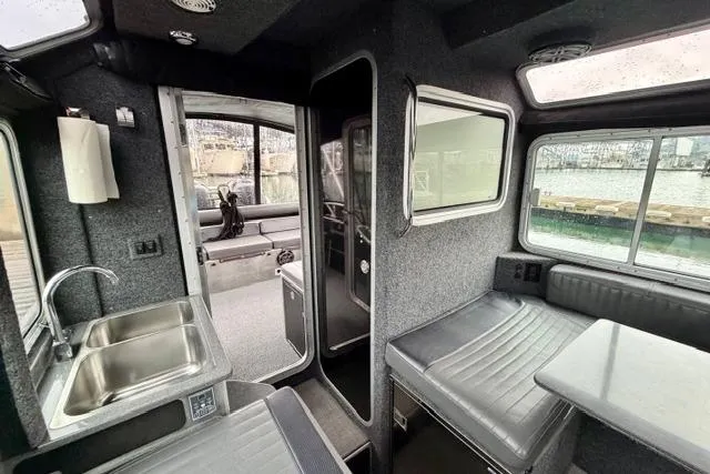 Slide: The Image of Interior of 2017 Life Proof 33 boat with seating, table, and sink. - 21