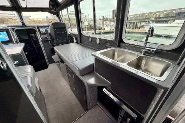 Slide: The Image of Interior of a 2017 Life Proof 33 boat with dual sinks and seating. - 26