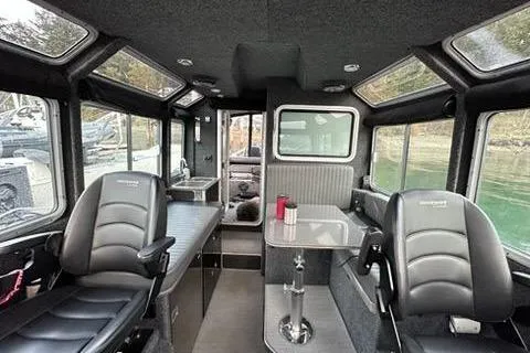 Slide: The Image of Interior of a 2017 Lifeproof 33 boat with modern seating and large windows. - 3