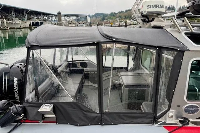 Slide: The Image of 2017 Life Proof 33 boat with enclosed cockpit, docked at marina. - 33