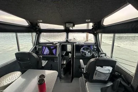 Slide: The Image of Interior of 2017 Lifeproof 33 boat with modern navigation equipment and seating. - 4