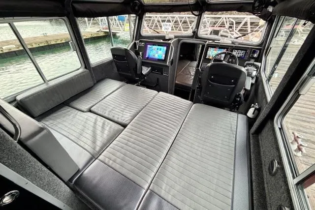 Slide: The Image of Interior of 2017 Life Proof 33 boat with seating and navigation equipment. - 6