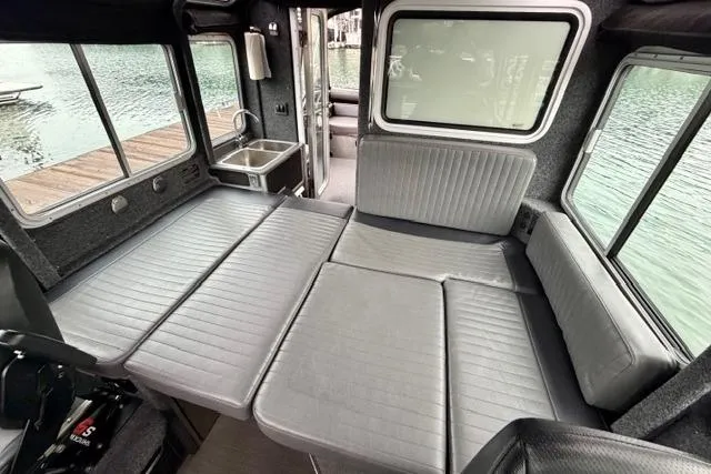 Slide: The Image of Interior of 2017 Life Proof 33 boat with convertible seating and windows. - 7