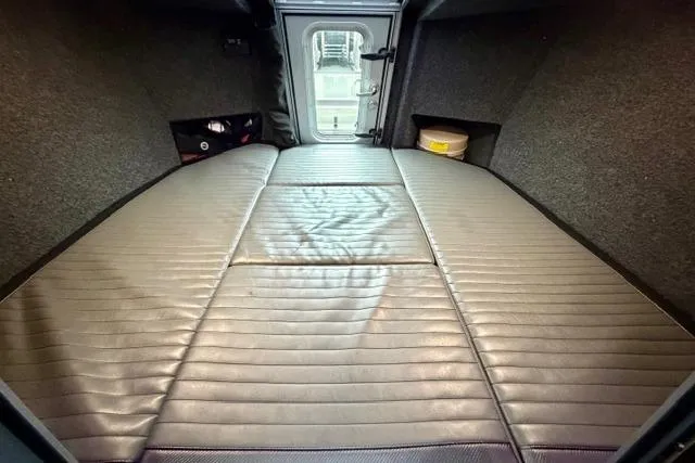 Slide: The Image of Interior view of 2017 Life Proof 33 boat cabin with cushioned sleeping area. - 8