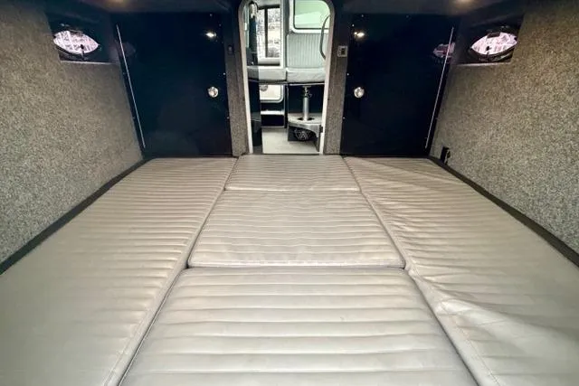 Slide: The Image of Interior of 2017 Life Proof 33 boat with cushioned seating and modern design. - 9