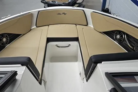 Slide: The Image of 2026 Sea Ray SPX 210 Outboard boat interior with tan seating and sleek design. - 10