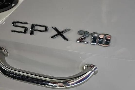 Slide: The Image of 2026 Sea Ray SPX 210 Outboard logo and chrome handle detail. - 4