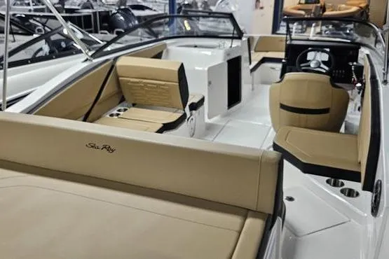 Slide: The Image of 2026 Sea Ray SPX 210 Outboard boat interior with tan seating and modern dashboard. - 5