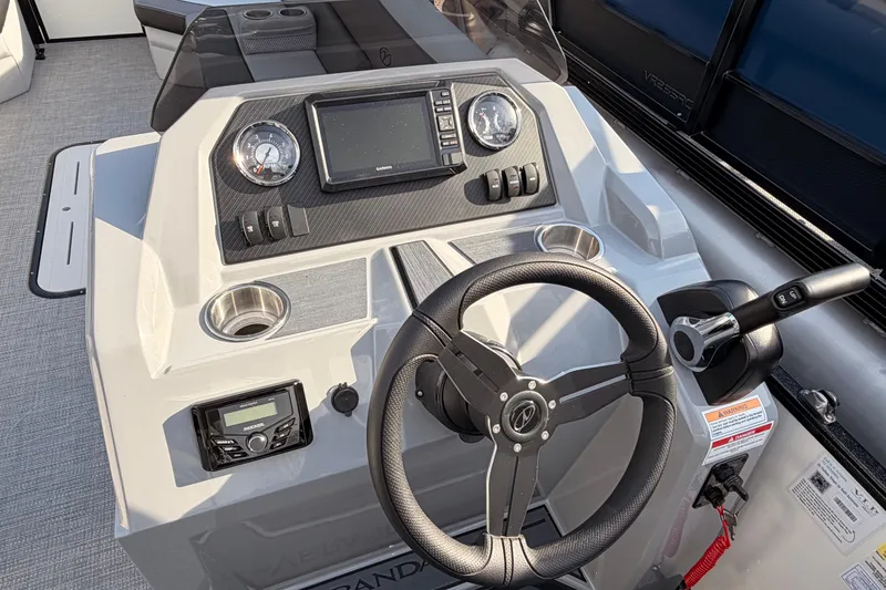Slide: The Image of 2026 Veranda Vista Sport VS 25 RC boat dashboard with steering wheel and controls. - 8