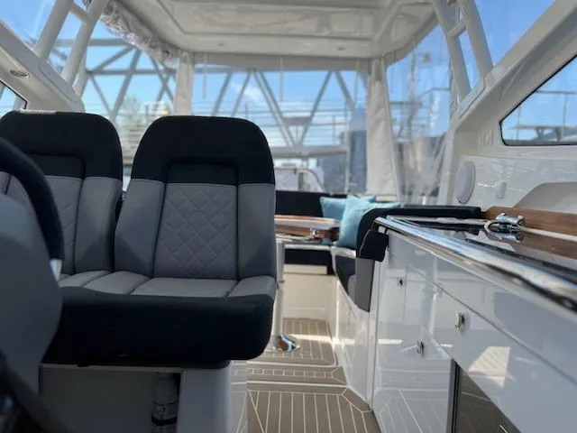 Slide: The Image of Interior of 2023 Nimbus W9 boat with modern seating and sleek design. - 10
