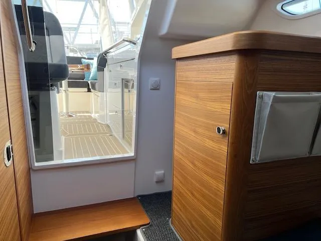 Slide: The Image of Interior of 2023 Nimbus W9 boat with wooden cabinetry and modern design. - 11