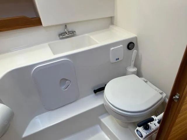 Slide: The Image of Compact bathroom in 2023 Nimbus W9 boat with toilet and sink. - 14