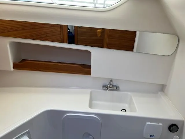 Slide: The Image of Modern bathroom interior of 2023 Nimbus W9 boat with sink and wooden accents. - 15
