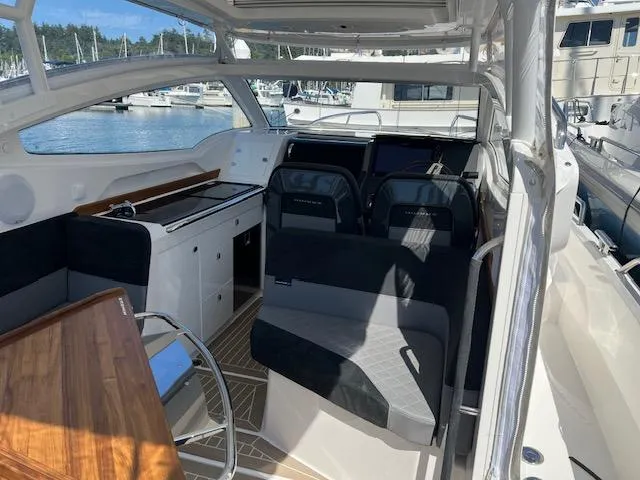 Slide: The Image of Interior of 2023 Nimbus W9 boat with modern seating and sleek design. - 27