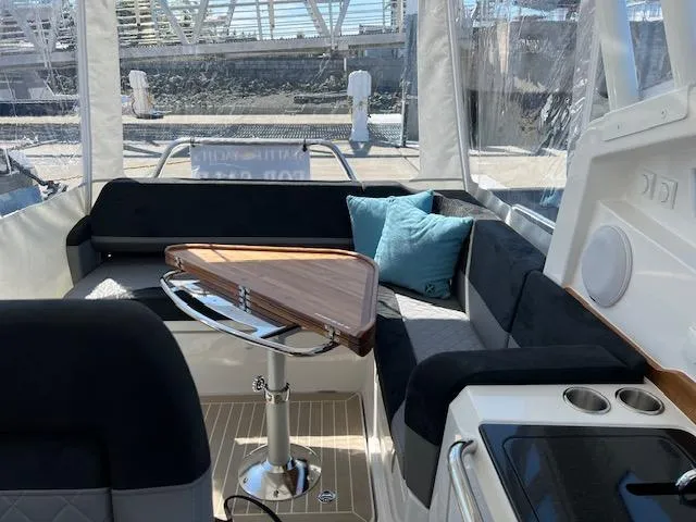 Slide: The Image of Luxurious interior of 2023 Nimbus W9 boat with sleek seating and modern amenities. - 30
