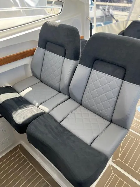 Slide: The Image of Luxurious seating in 2023 Nimbus W9 boat with quilted upholstery and modern design. - 32