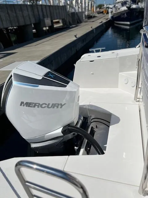 Slide: The Image of 2023 Nimbus W9 boat with Mercury outboard engine at dock. - 5