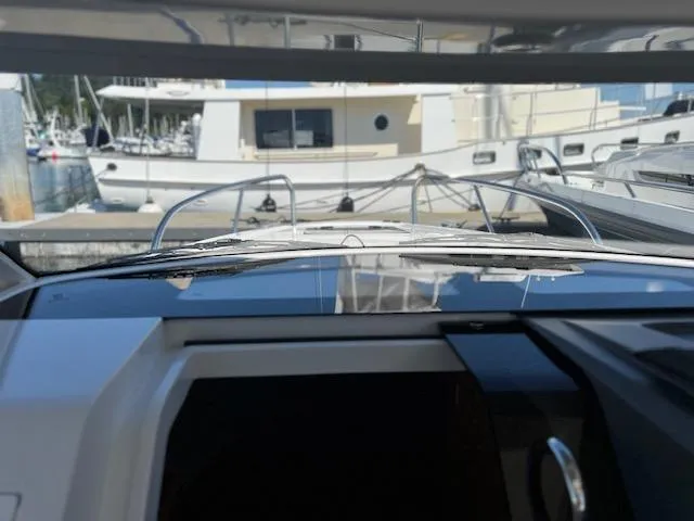 Slide: The Image of Nimbus W9 2023 boat docked at marina, view from cockpit. - 9