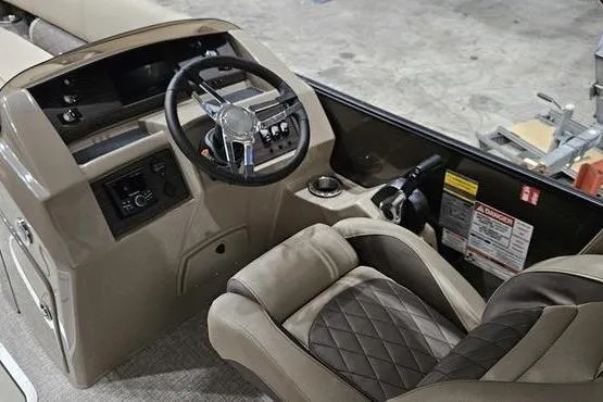 Slide: The Image of 2026 Bennington 24 L Swingback boat interior with steering wheel and control panel. - 11