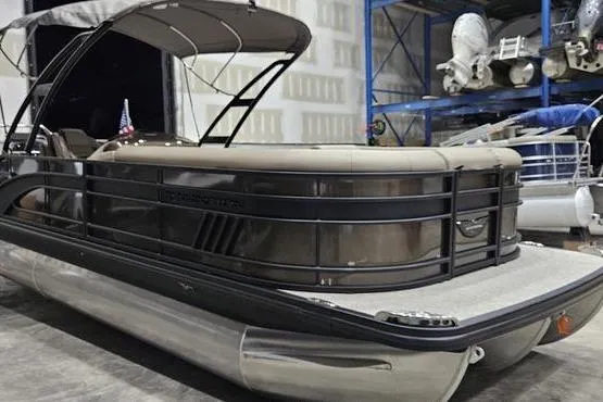 Slide: The Image of 2026 Bennington 24 L Swingback pontoon boat in a showroom setting. - 3