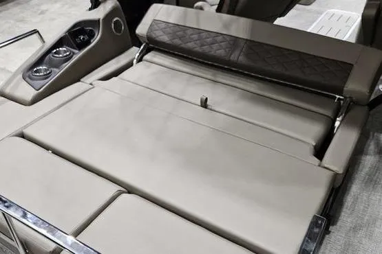 Slide: The Image of Luxurious seating in 2026 Bennington 24 L Swingback pontoon boat, featuring premium upholstery and cup holders. - 9