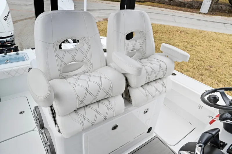 Slide: The Image of Luxurious seating on 2023 Costa Custom Boats 264 HC, featuring elegant white upholstery. - 15